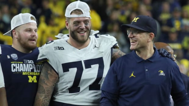 Michigan offensive lineman Trevor Keegan and coach Jim Harbaugh.